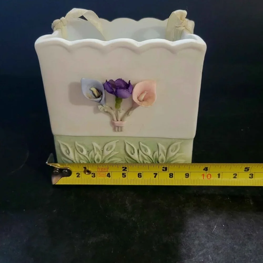 Vintage Porcelain Basket With Floral Embellishments And Decorative Ribbon